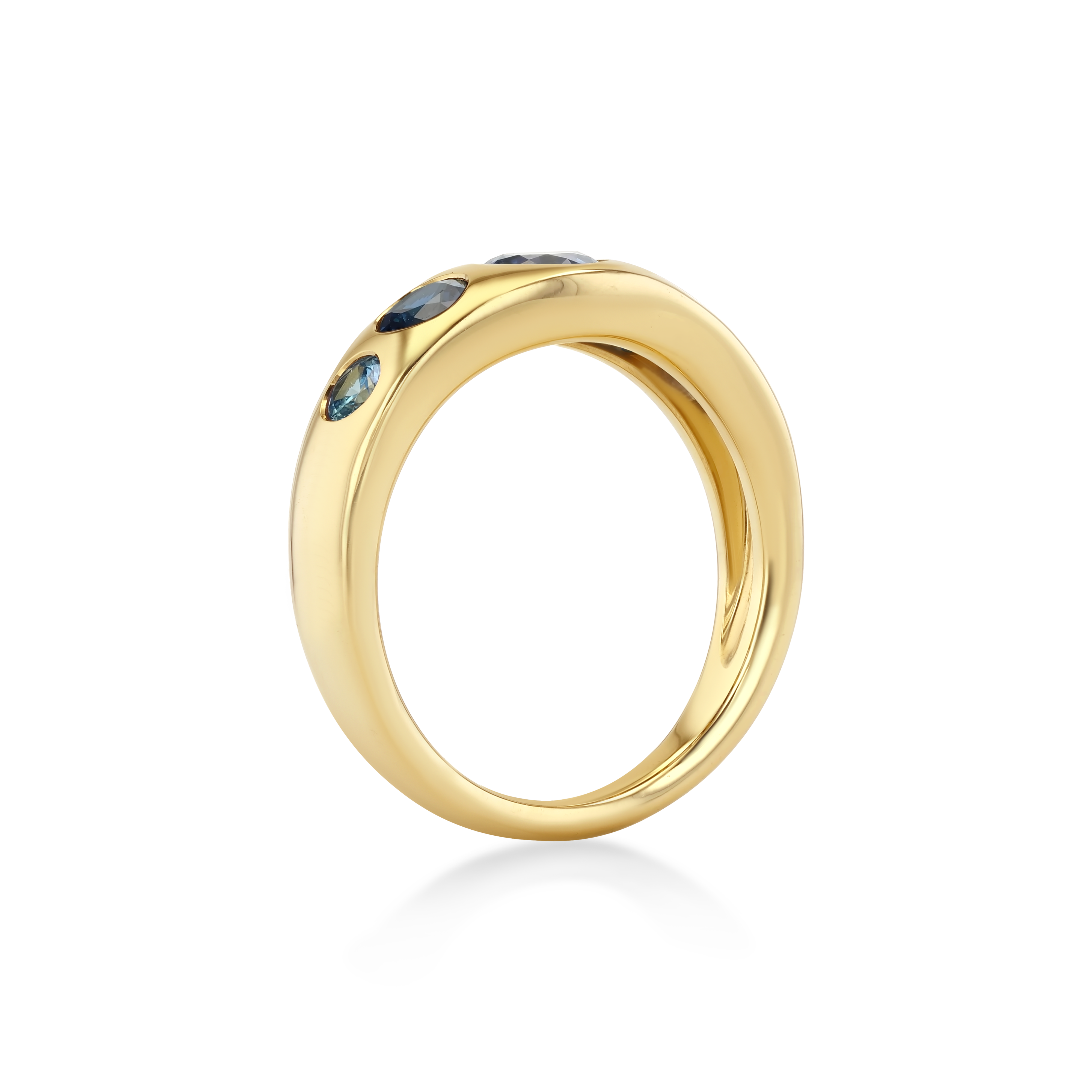A polished yellow gold ring featuring three small dark blue gemstones set along the upper outer edge.