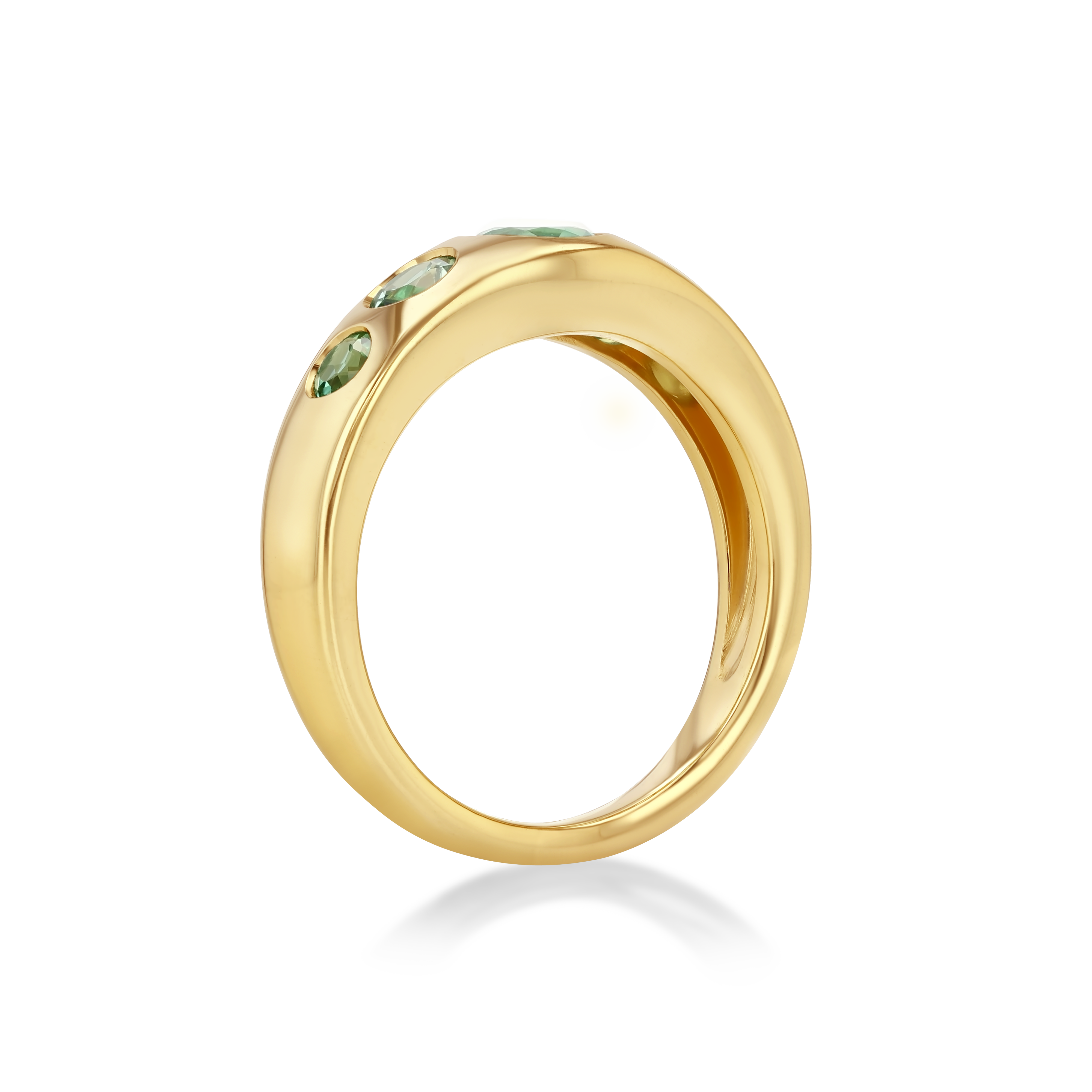 A polished yellow gold ring featuring three small green gemstones set along the upper curve.