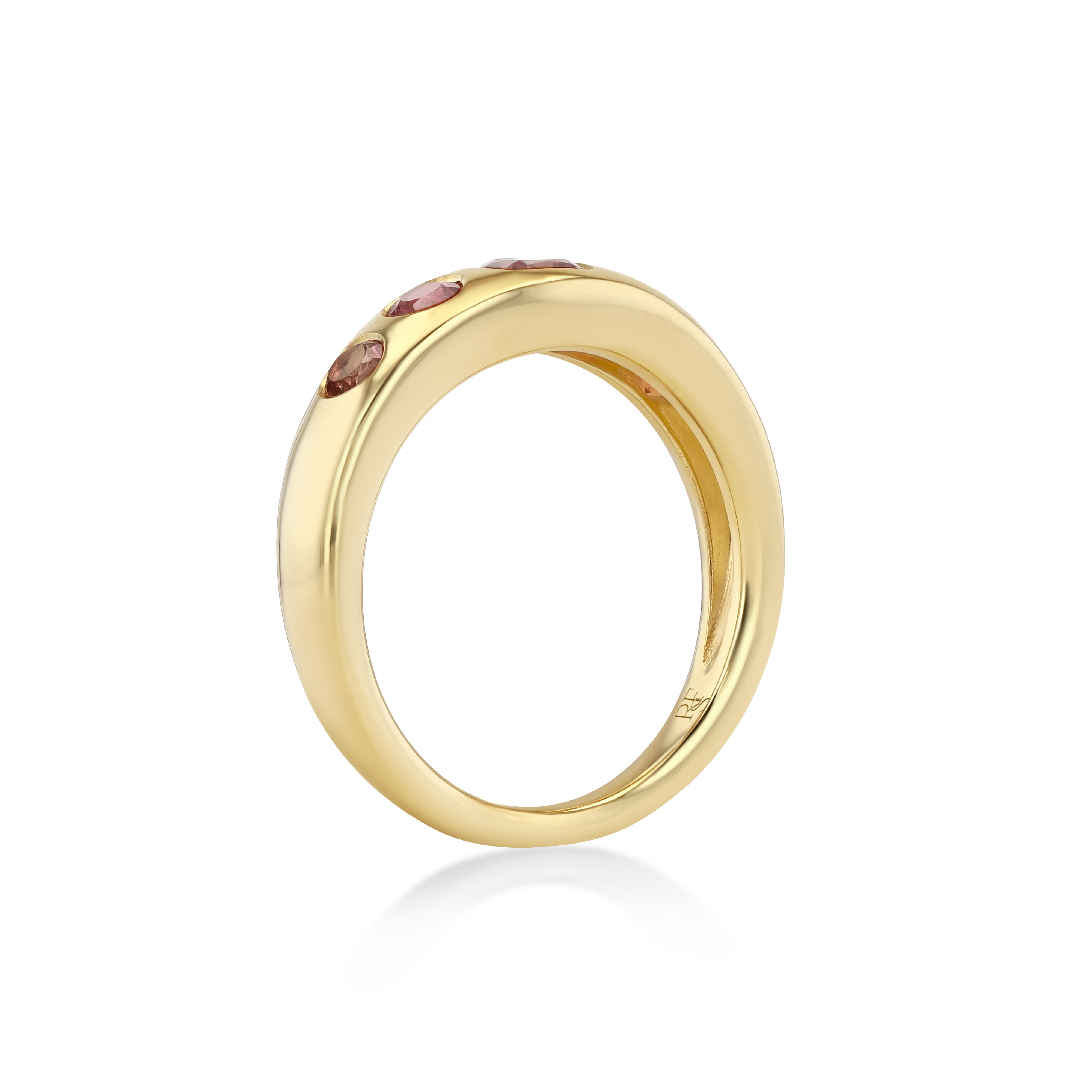 A polished yellow gold ring with a row of small pink gemstones set along the top.