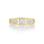 A yellow gold ring featuring a large emerald-cut diamond in the center flanked by four smaller round diamonds.