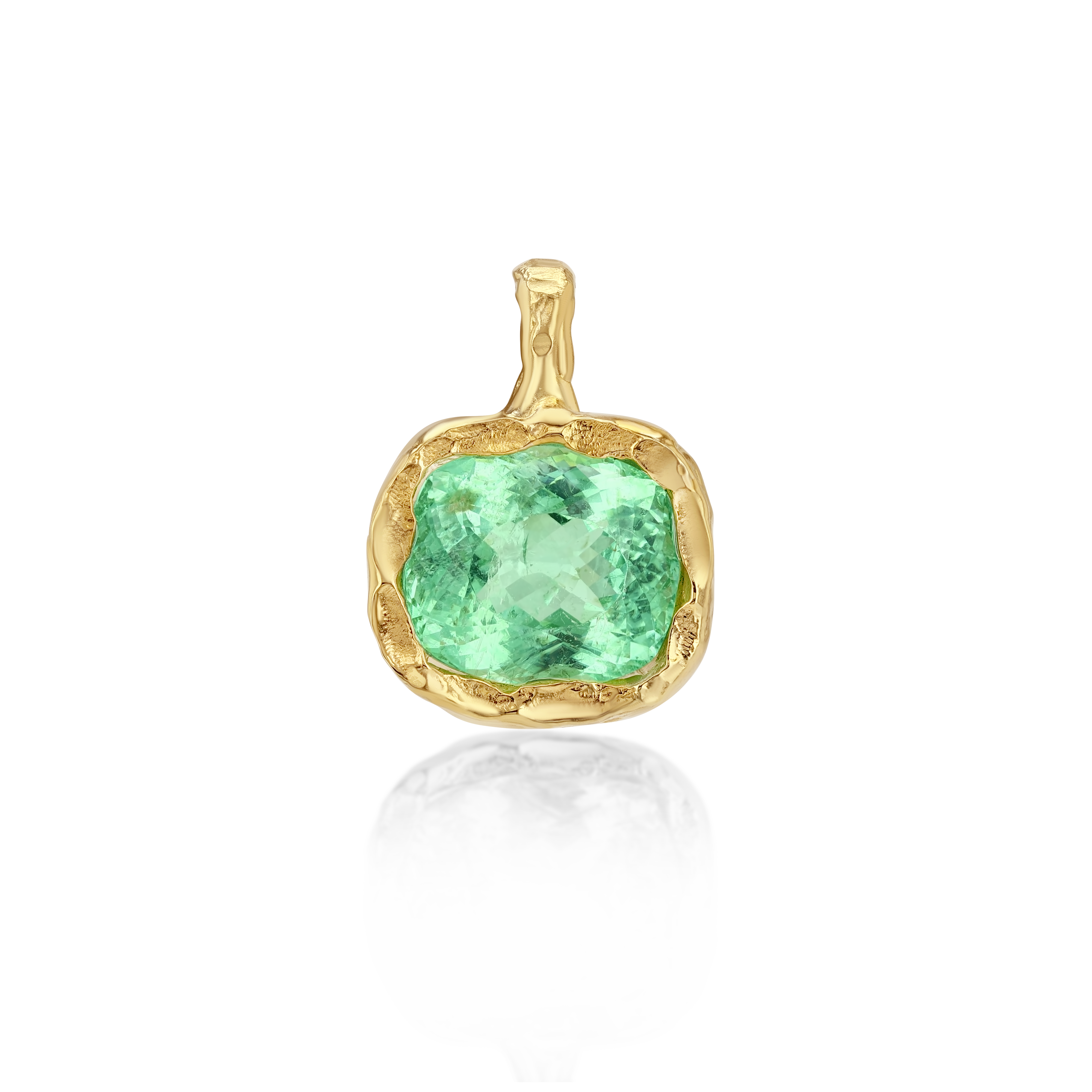 Gold pendant with a green gemstone on a white background