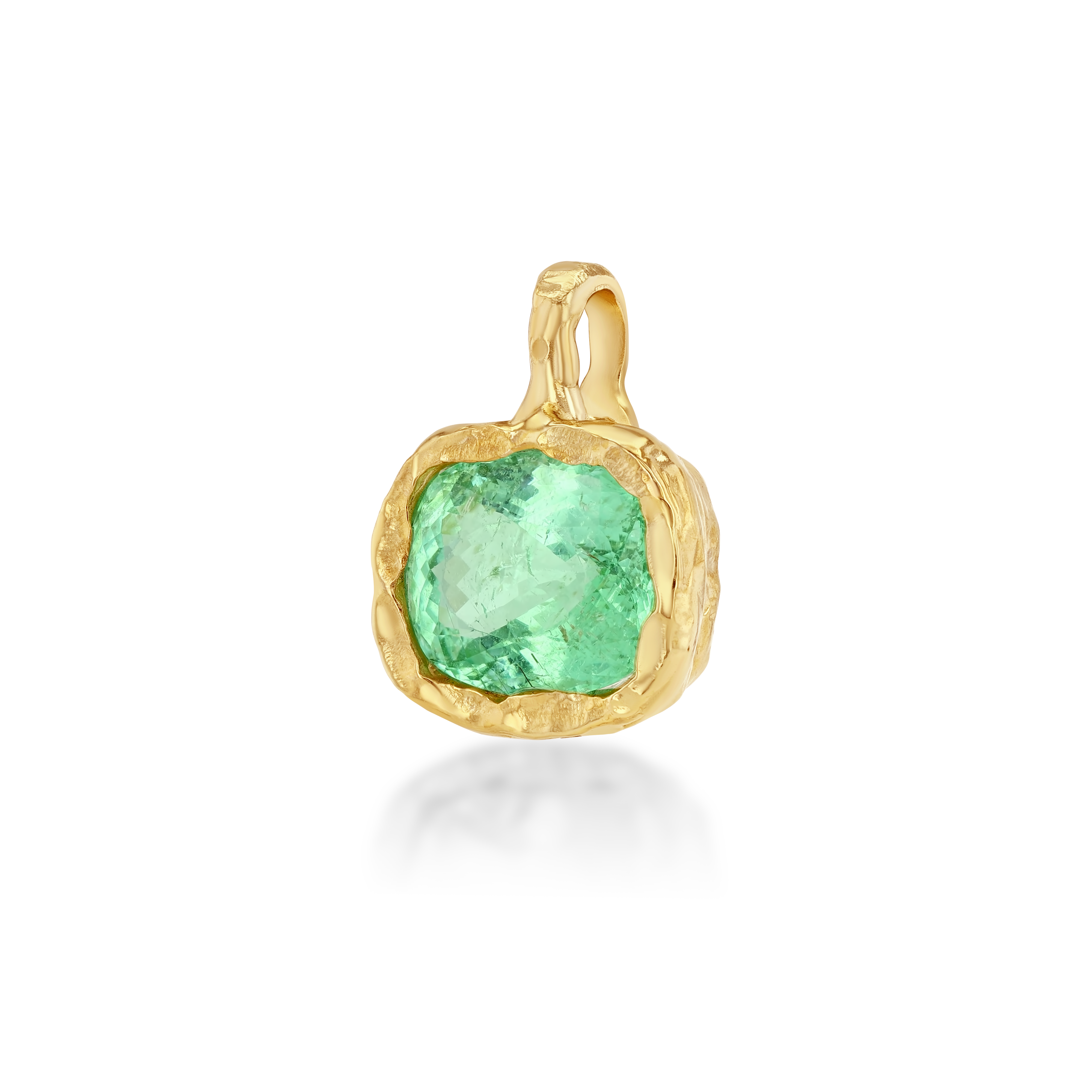 Gold pendant with a green gemstone on a white background