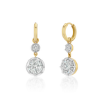 A pair of gold and white gold drop earrings with round-cut diamonds, shown on a clean white background with a soft reflection below.