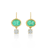 A pair of gold drop earrings featuring oval green emerald-cut stones and a round clear diamond hanging below each, set against a plain white background.