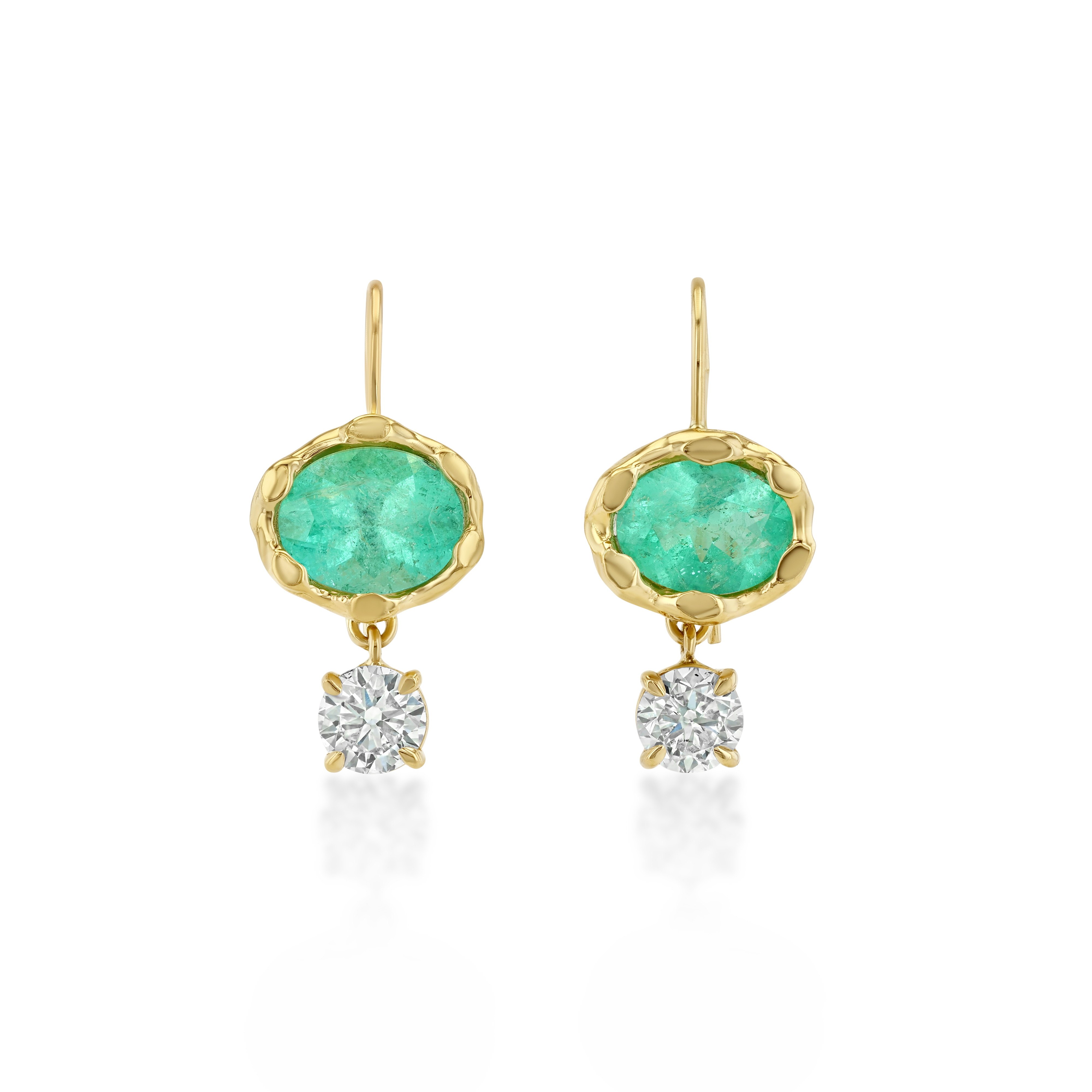 A pair of gold drop earrings featuring oval green emerald-cut stones and a round clear diamond hanging below each, set against a plain white background.