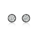 A pair of round-cut stud earrings with brilliant clear gemstones in dark metal bezel settings, shown on a clean white background with soft reflections below.