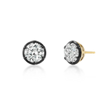 A pair of round-cut stud earrings with clear gemstones in black bezel settings and yellow gold posts, shown on a clean white background.