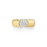 A yellow gold solitaire ring featuring a round brilliant-cut diamond set in a classic four-prong setting, centered on a clean white background with a soft reflection below.