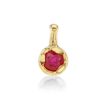 A gold pendant featuring a round faceted pinkish-red gemstone in a textured bezel setting, shown on a clean white background with a soft reflection below.