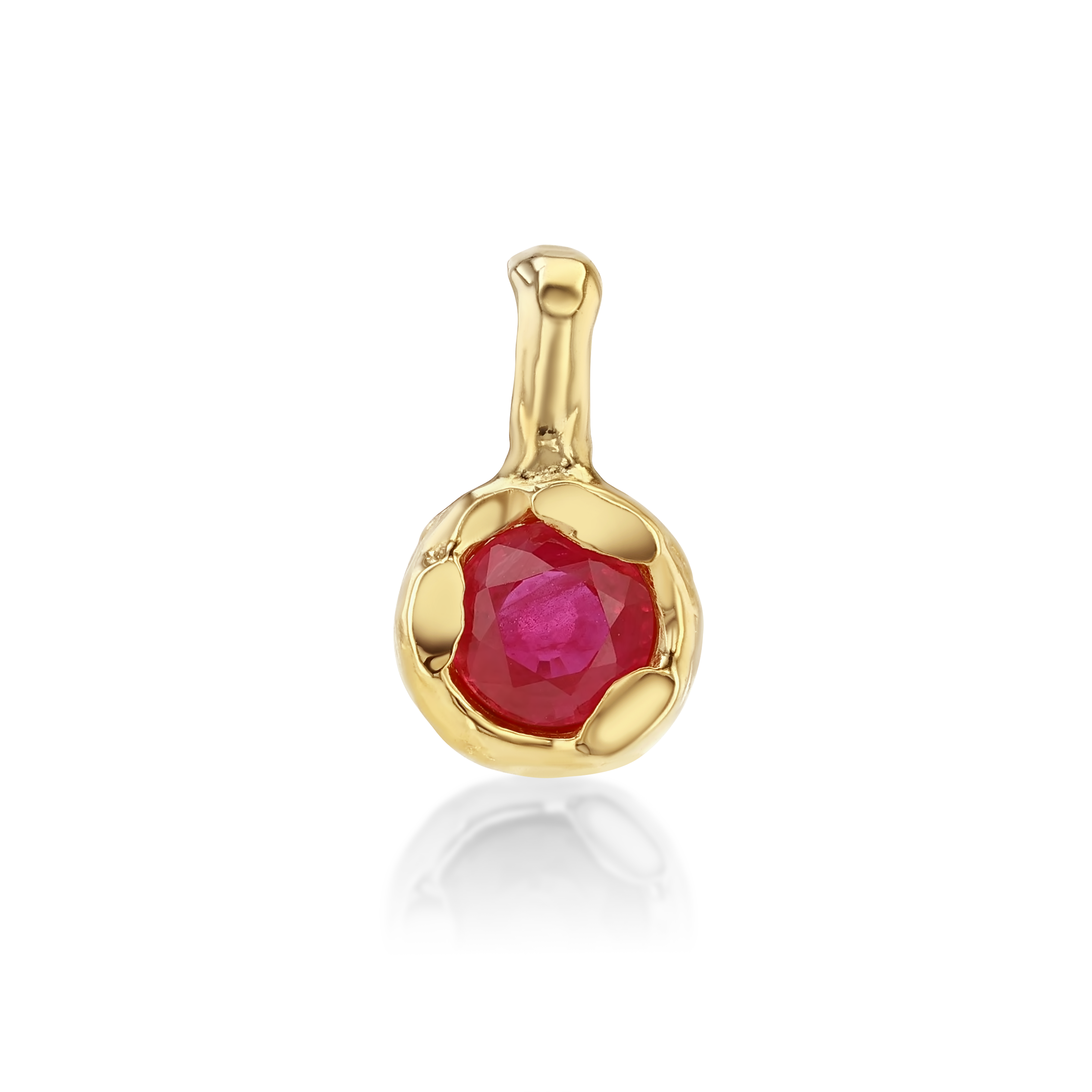 A gold pendant featuring a round faceted pinkish-red gemstone in a textured bezel setting, shown on a clean white background with a soft reflection below.