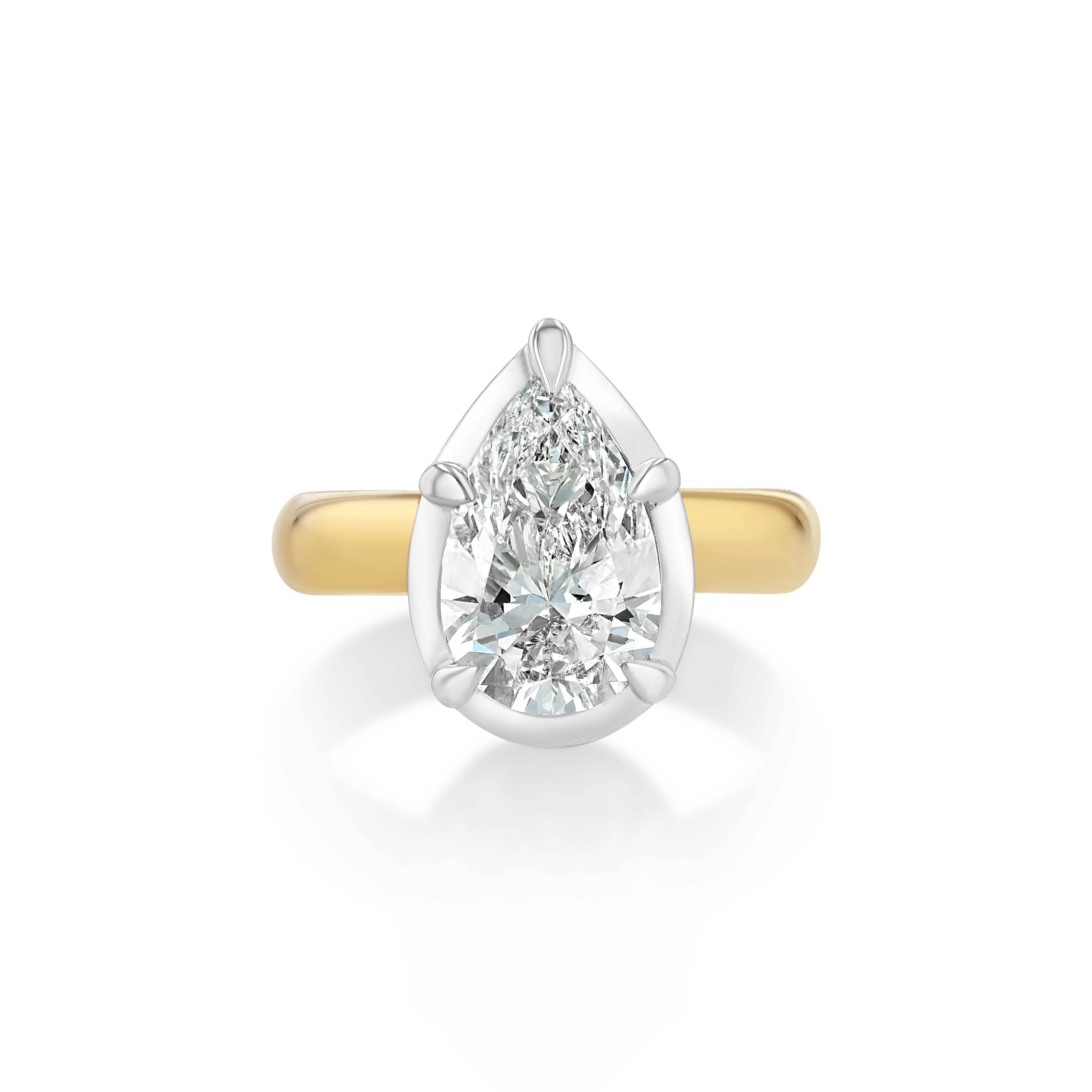 Mega Pear Button Back Pinky Ring crafted in 14k yellow and white gold, featuring a 1.5ct lab-grown pear diamond. Designed in a pear-shaped silhouette as a reimagining of the Mega Marquise style and made specifically to fit the pinky.