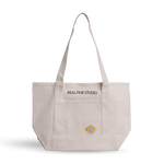 Real Fine Tote — a spacious everyday canvas bag with long shoulder straps, a built-in zipper for securing essentials, and custom embroidery by Abbode in New York. Blue Heirloom embroidery.