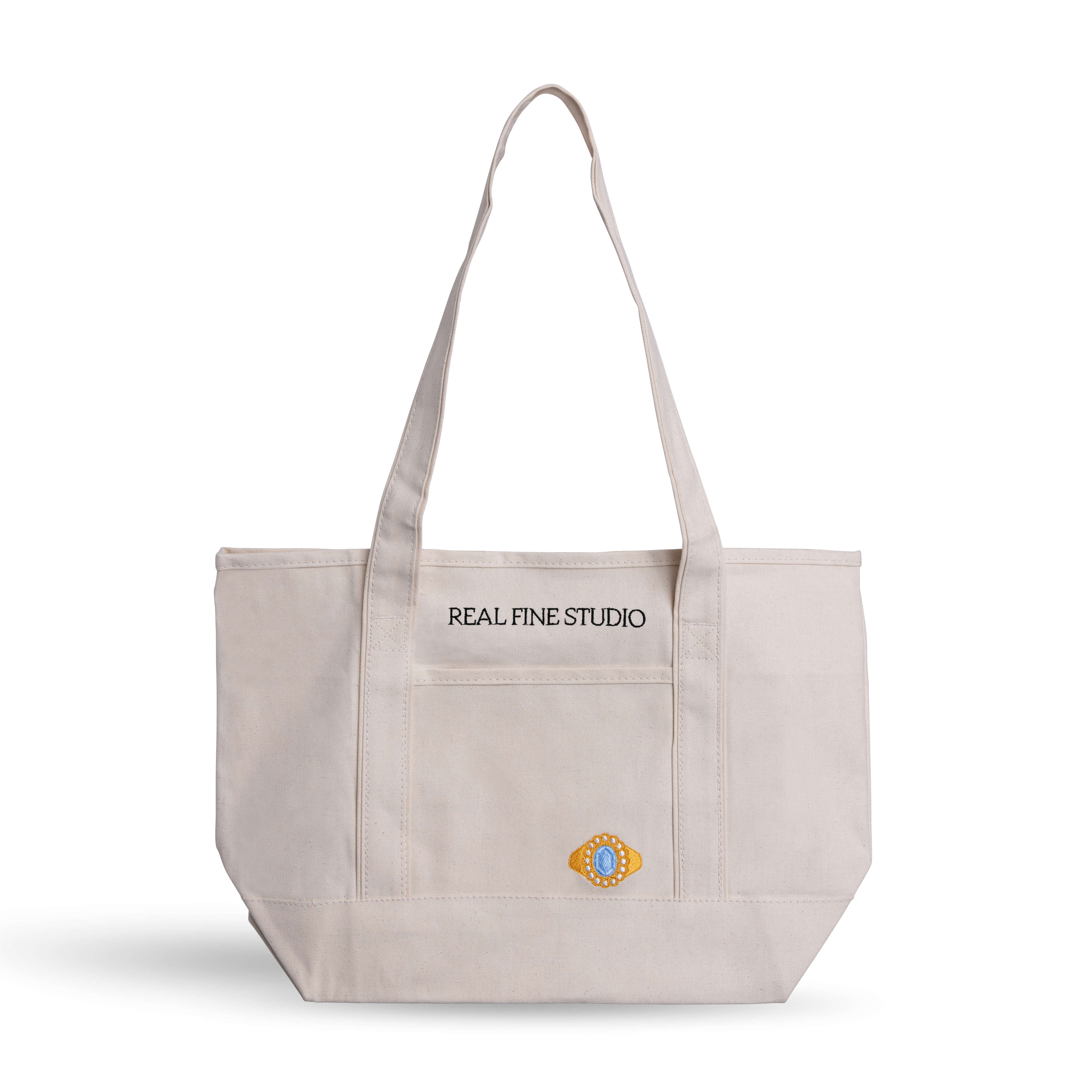 Real Fine Tote — a spacious everyday canvas bag with long shoulder straps, a built-in zipper for securing essentials, and custom embroidery by Abbode in New York. Blue Heirloom embroidery.