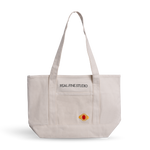 Real Fine Tote — a spacious everyday canvas bag with long shoulder straps, a built-in zipper for securing essentials, and custom embroidery by Abbode in New York. Red Heirloom embroidery. 